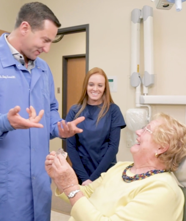 Dr Lesneski meets a patient | greater michigan oral surgeons implant center
